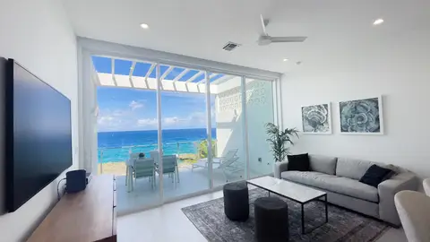 Sunset Point Ocean Front Condo Top Floor 4.6% ROI !