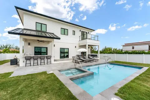 FOR SALE: Auburn Bay, Canal Front 5 Bedroom PLUS Den Home
